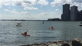 a canoe floats in Brooklyn